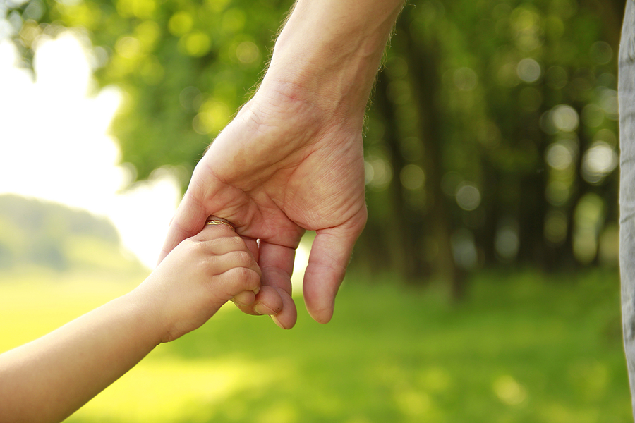 child holding hand