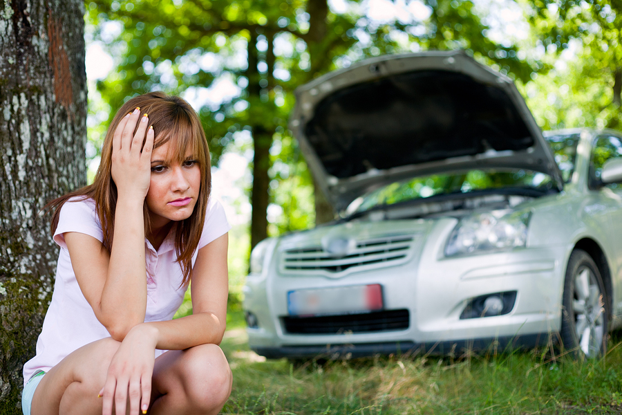 Woman with broken car