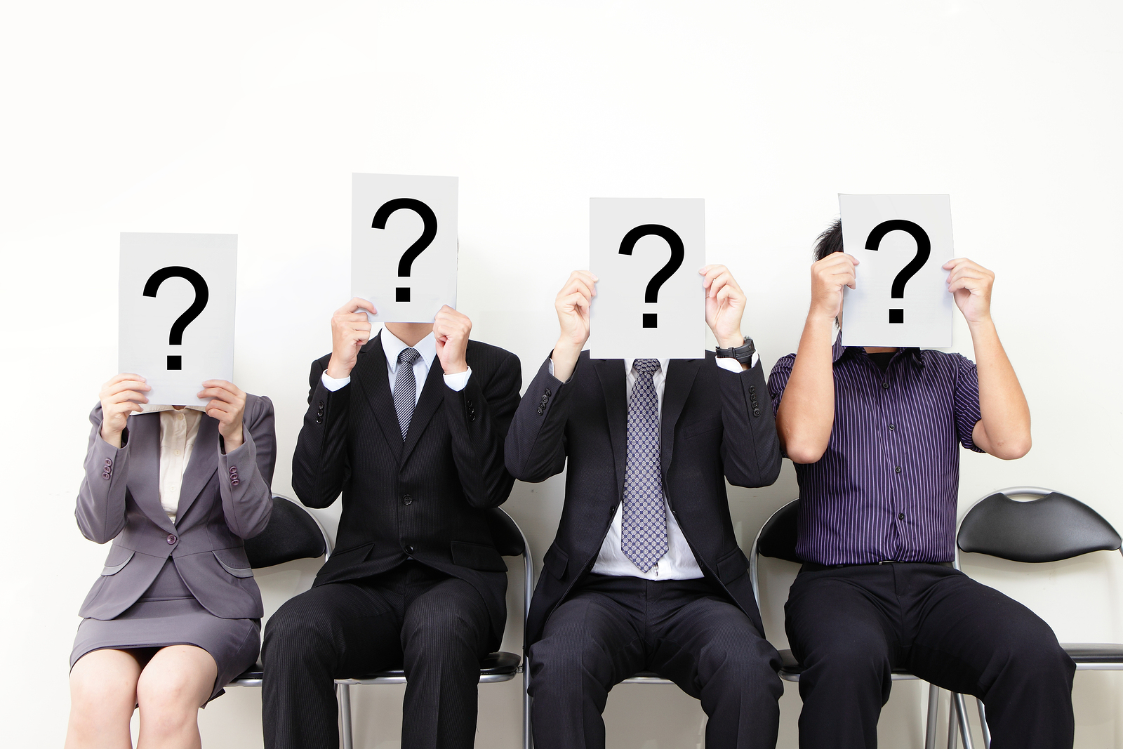 Human resource concept Young businessman holding white billboard with a question mark on it and waiting for job interview asian people