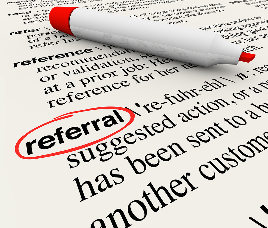 The word Referral circled in a dictionary showing its definition