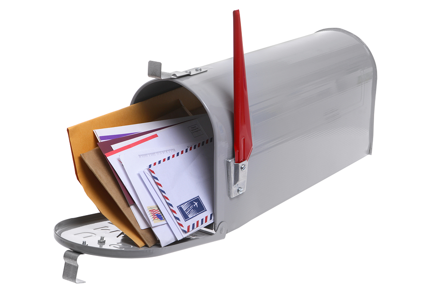 Grey Mailbox full of mail isolated on a white background