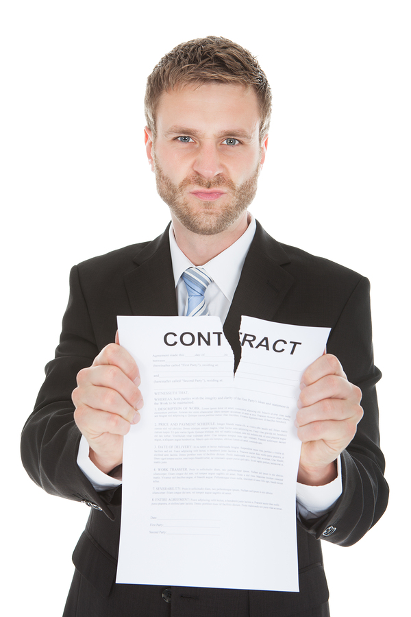 Angry Businessman Tearing Contract Paper