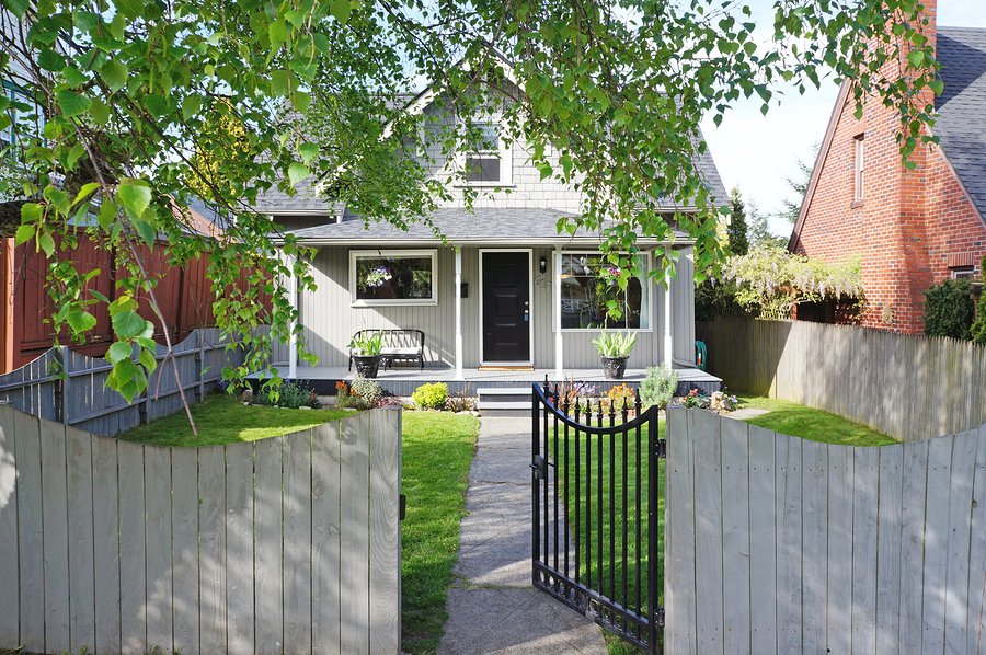 House Exterior. Entrance Porch And Front Yard View