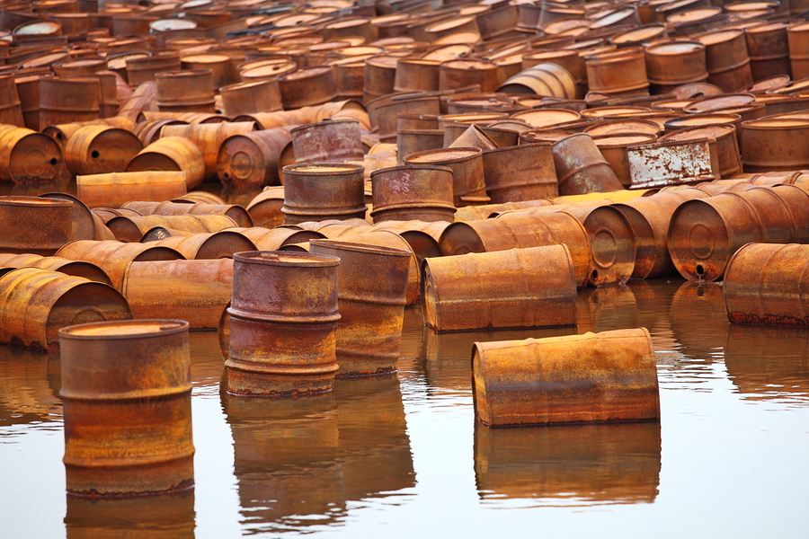 Rusty fuel and chemical drums on Arctic coast