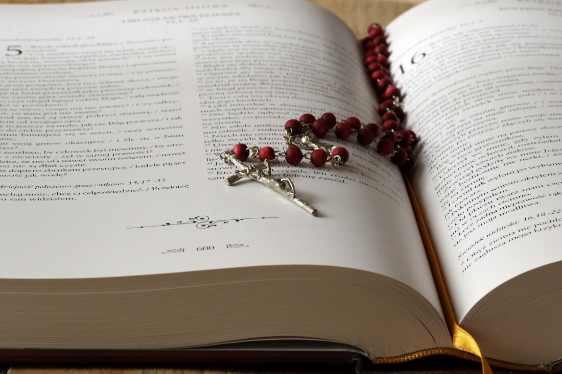 Bible with a rosary